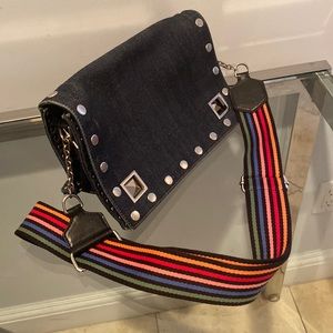 Denim pocket book with rainbow colored strap